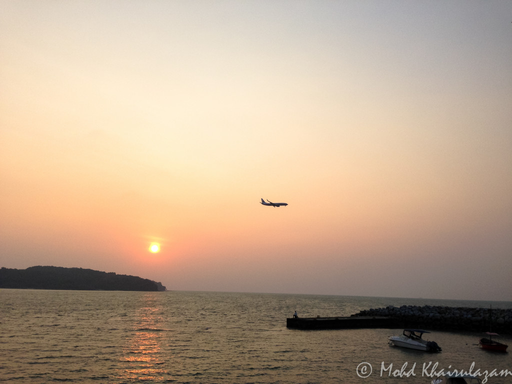 MAS airplane crossing sunset at Pantai Chenang, Langkawi